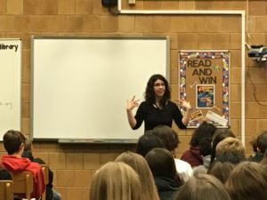 Author Rachel Hartman speaks to students in the Bennion Jr. High Media Center